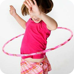 Child having fun in a hula hoop